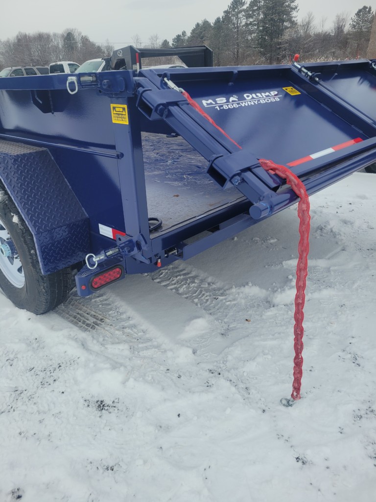 General Welding & Fabricating’s blue MSA 6-ton dump trailer displayed in a Memorial Day sale ad, emphasizing its heavy-duty build and special $12,000 price offer.
