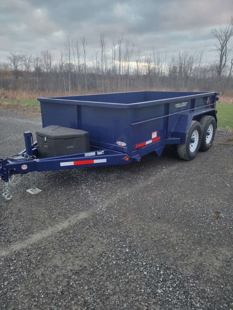 General Welding & Fabricating’s blue MSA 6-ton dump trailer displayed in a Memorial Day sale ad, emphasizing its heavy-duty build and special $12,000 price offer.