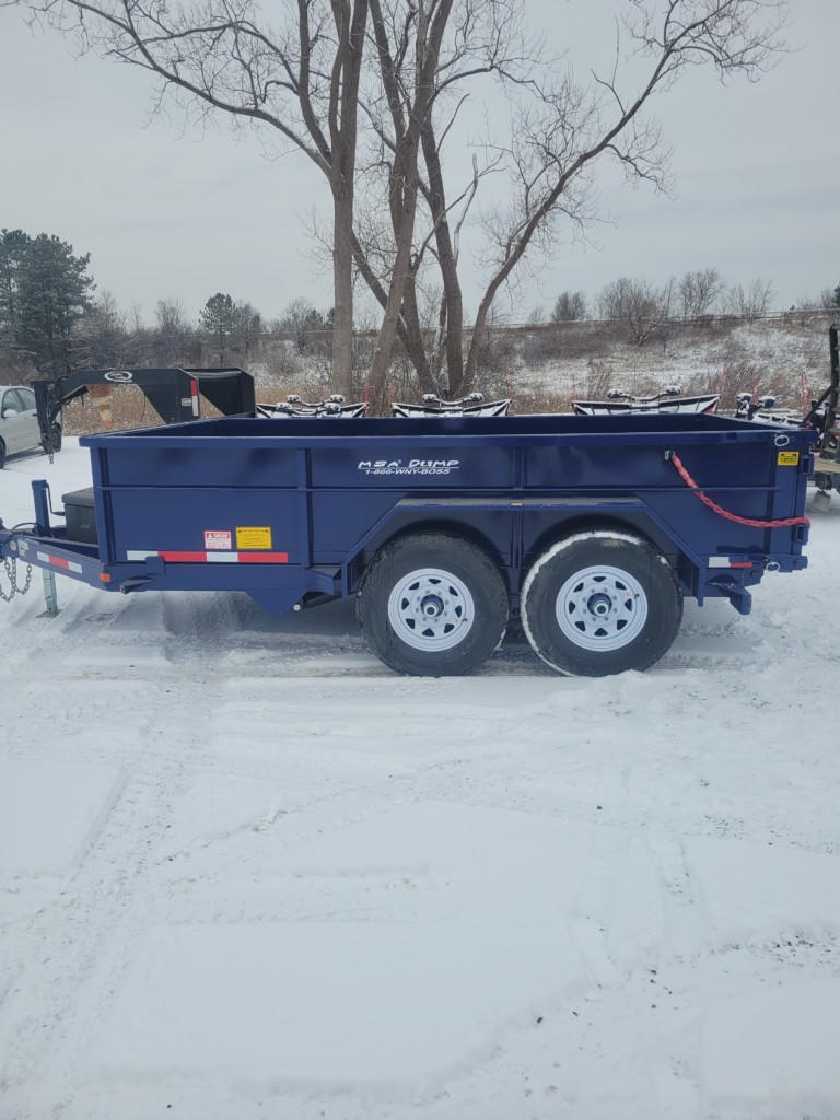 General Welding & Fabricating’s blue MSA 6-ton dump trailer displayed in a Memorial Day sale ad, emphasizing its heavy-duty build and special $12,000 price offer.