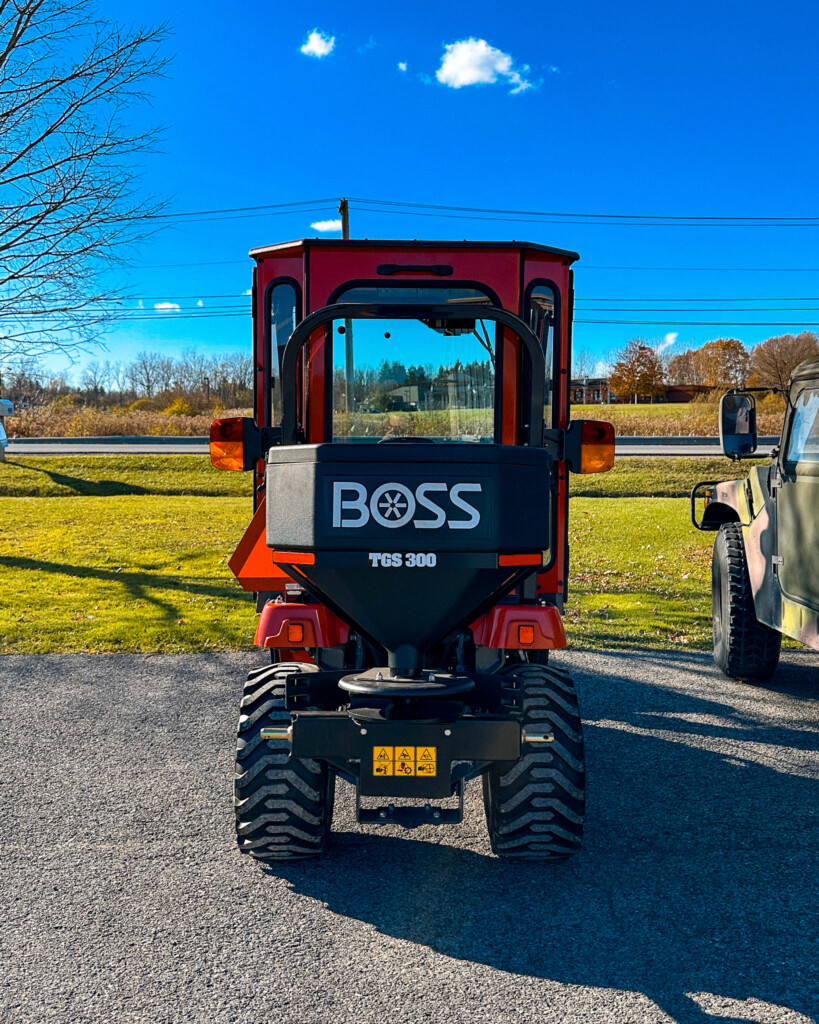 Tractor equipped with a BOSS Snowplow TGS 300 Salt Spreaders