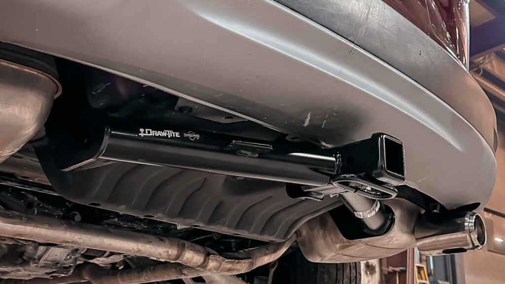 Honda CRV loaded on the lift for a receiver pipe installation.